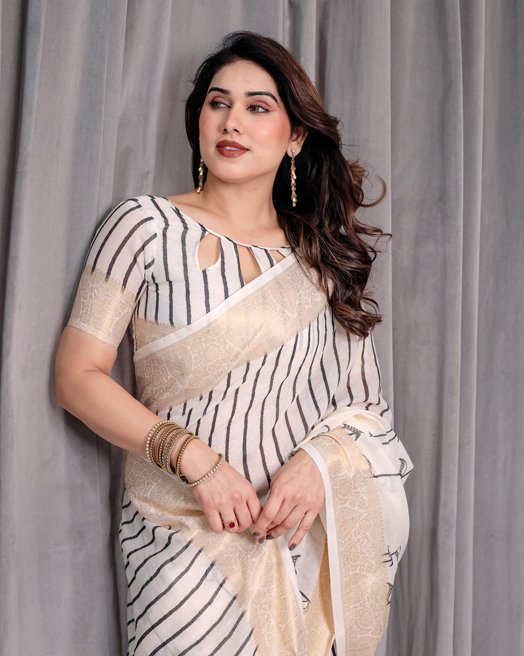 Off-White Handloom Linen Saree with Black Vertical Stripes & Tribal Motifs | Golden Zari Border & Tassel Pallu | Attached Blouse | 5.5m Saree + 0.8m Blouse