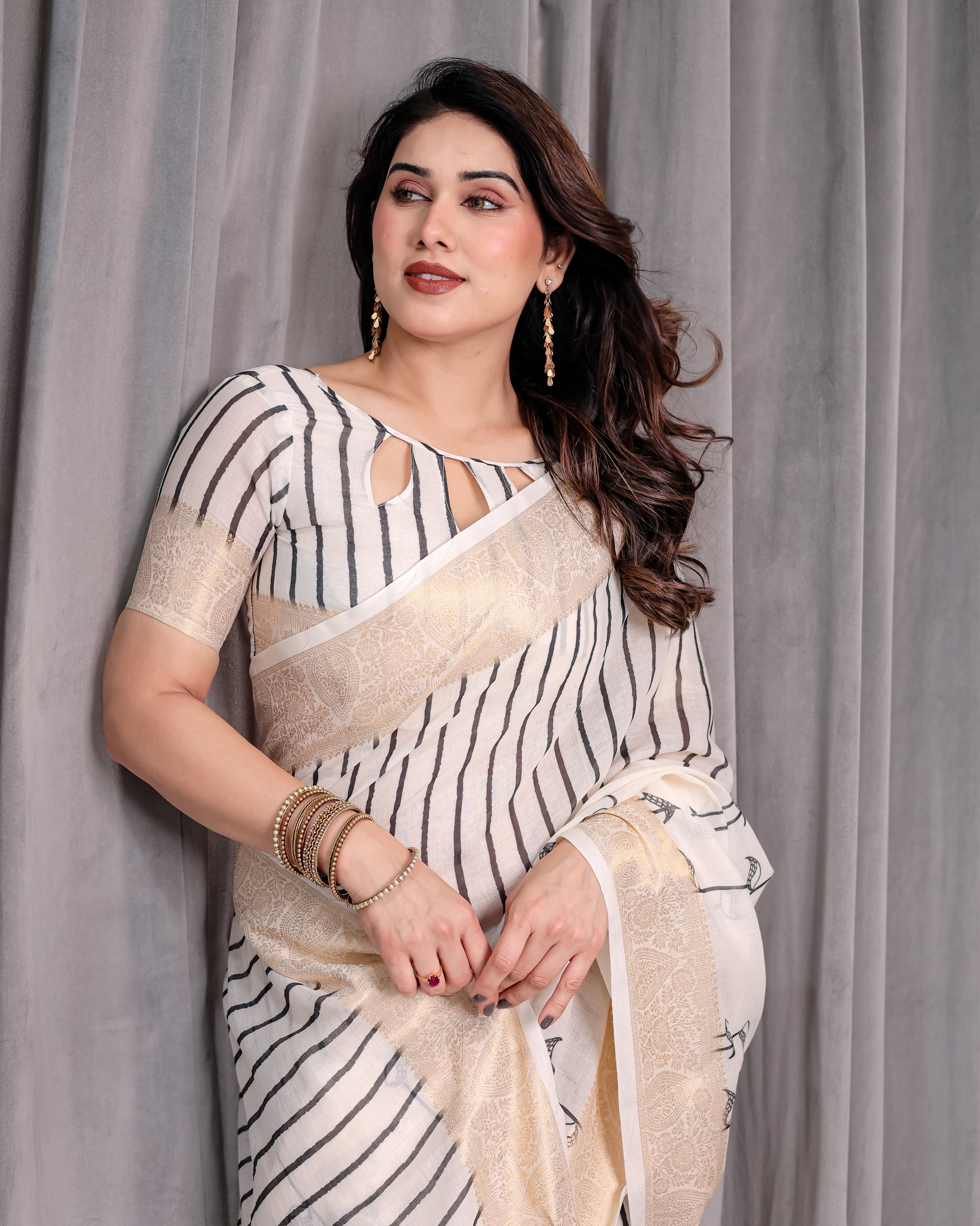 Off-White Handloom Linen Saree with Black Vertical Stripes & Tribal Motifs | Golden Zari Border & Tassel Pallu | Attached Blouse | 5.5m Saree + 0.8m Blouse