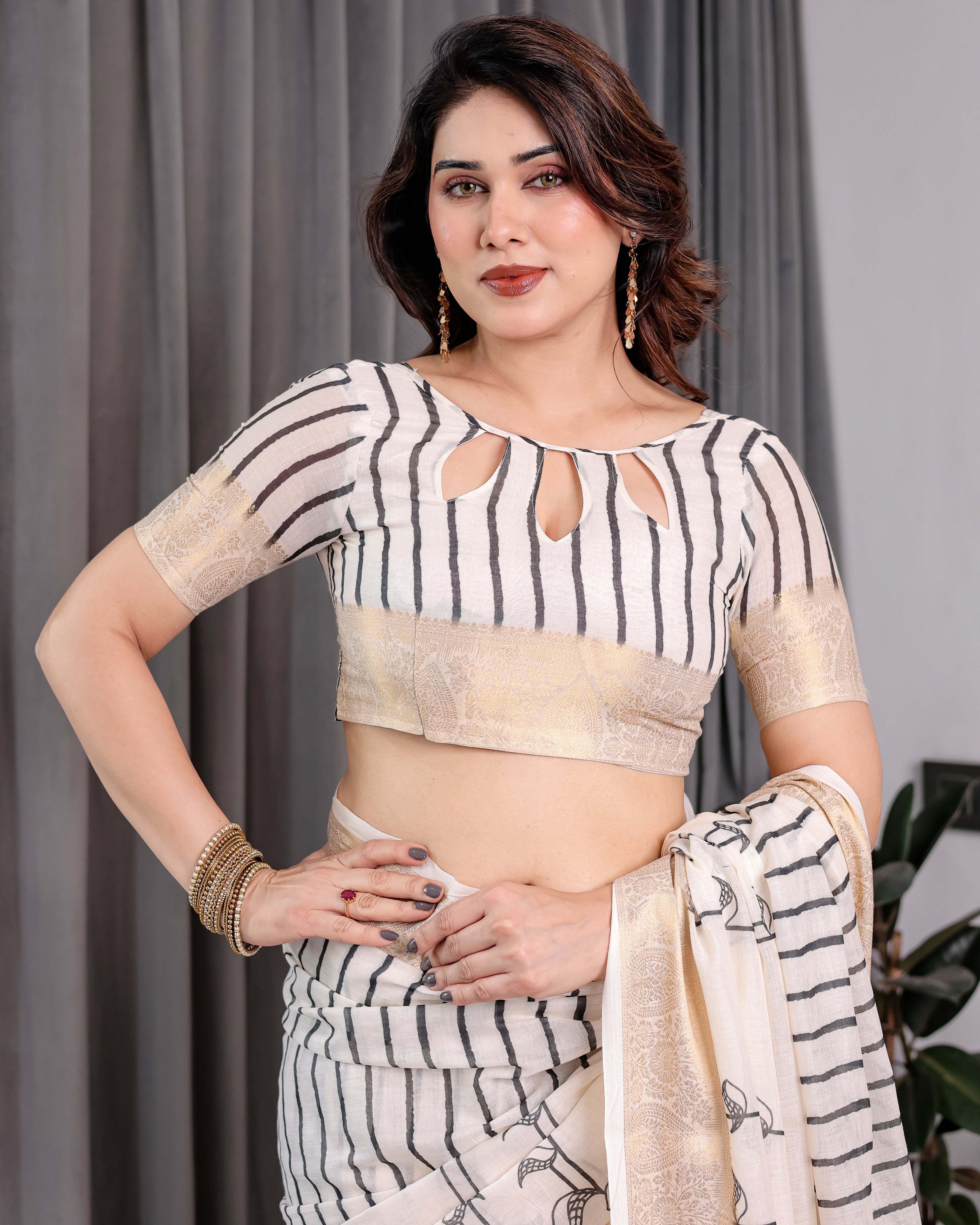 Off-White Handloom Linen Saree with Black Vertical Stripes & Tribal Motifs | Golden Zari Border & Tassel Pallu | Attached Blouse | 5.5m Saree + 0.8m Blouse