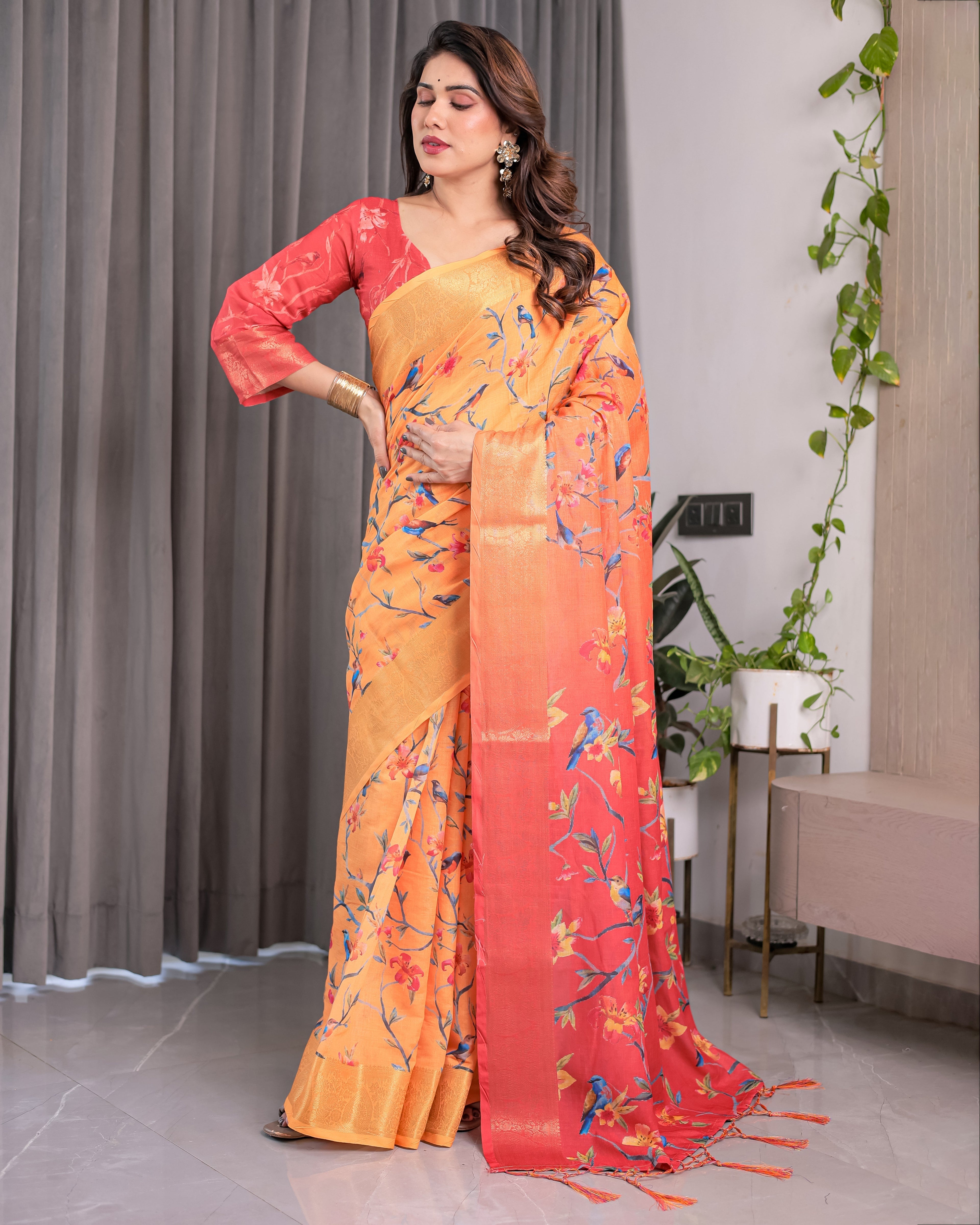 Sunset Orange Handloom Linen Saree with Bluebird & Floral Digital Print | Contrasting Red Pallu & Gold Zari Border | Tassel Detailing | Attached Blouse | 5.5m Saree + 0.8m Blouse