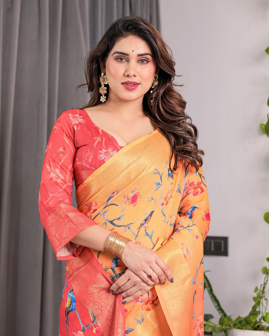 Sunset Orange Handloom Linen Saree with Bluebird & Floral Digital Print | Contrasting Red Pallu & Gold Zari Border | Tassel Detailing | Attached Blouse | 5.5m Saree + 0.8m Blouse