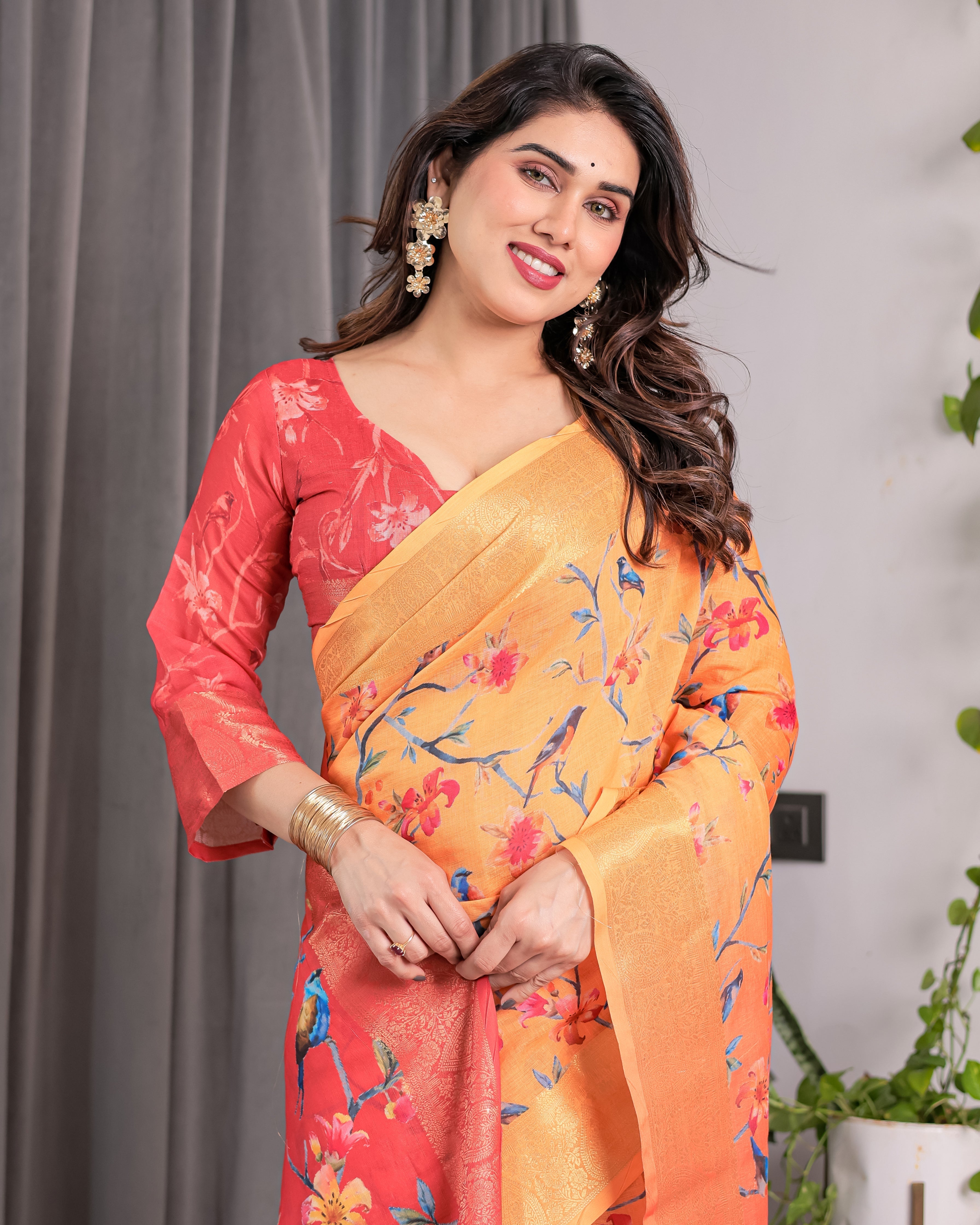 Sunset Orange Handloom Linen Saree with Bluebird & Floral Digital Print | Contrasting Red Pallu & Gold Zari Border | Tassel Detailing | Attached Blouse | 5.5m Saree + 0.8m Blouse