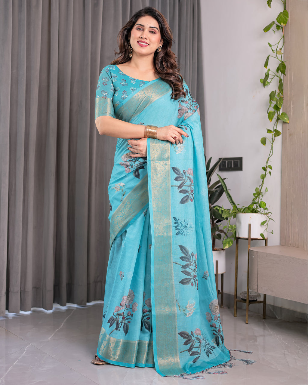 Turquoise Blue Handloom Linen Saree with Floral Digital Print & Golden Zari Border | Tassel Detailing | Attached Blouse | 5.5m Saree + 0.8m Blouse