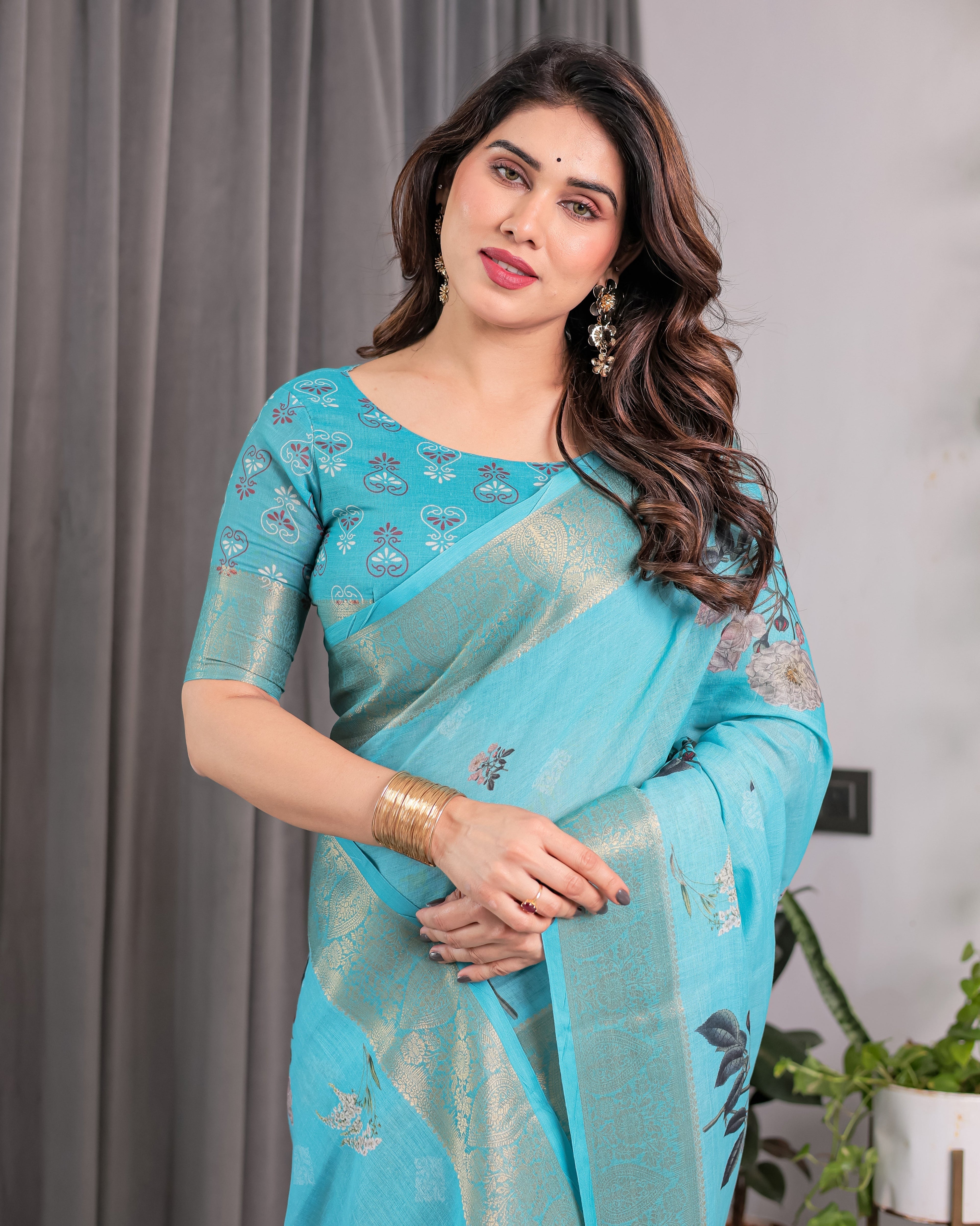 Turquoise Blue Handloom Linen Saree with Floral Digital Print & Golden Zari Border | Tassel Detailing | Attached Blouse | 5.5m Saree + 0.8m Blouse