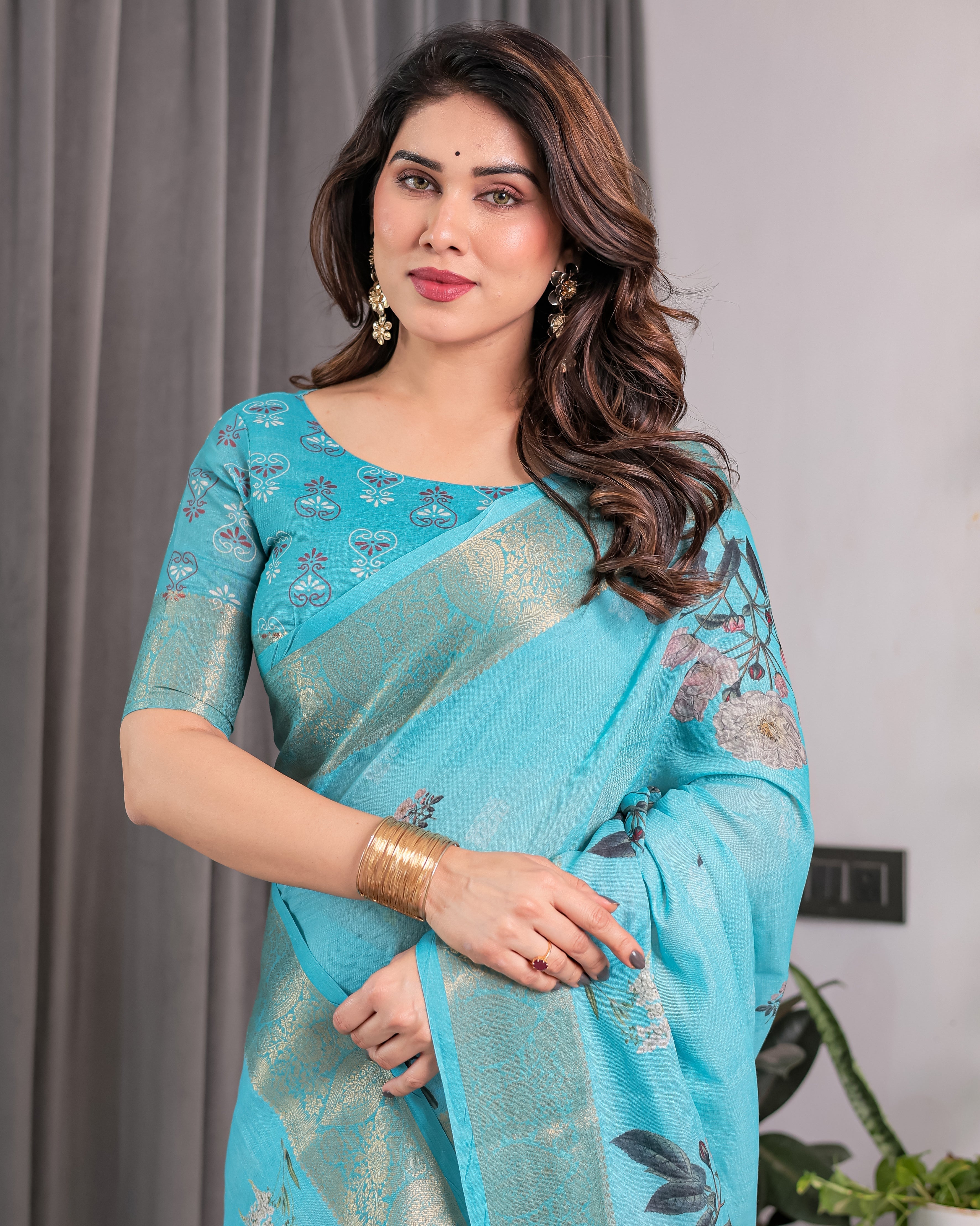 Turquoise Blue Handloom Linen Saree with Floral Digital Print & Golden Zari Border | Tassel Detailing | Attached Blouse | 5.5m Saree + 0.8m Blouse