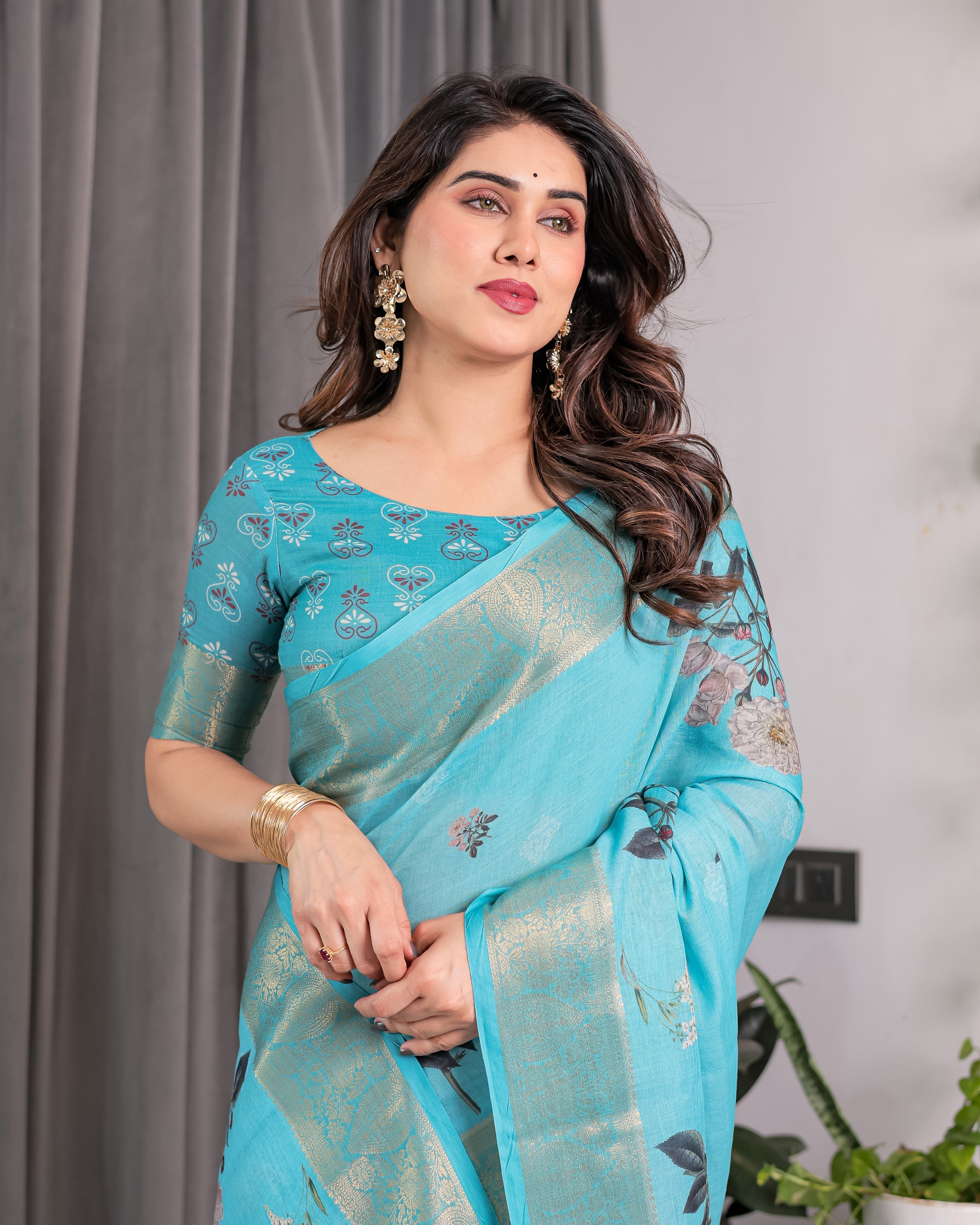 Turquoise Blue Handloom Linen Saree with Floral Digital Print & Golden Zari Border | Tassel Detailing | Attached Blouse | 5.5m Saree + 0.8m Blouse